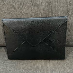 This is a black leather Real Simple Style purse.